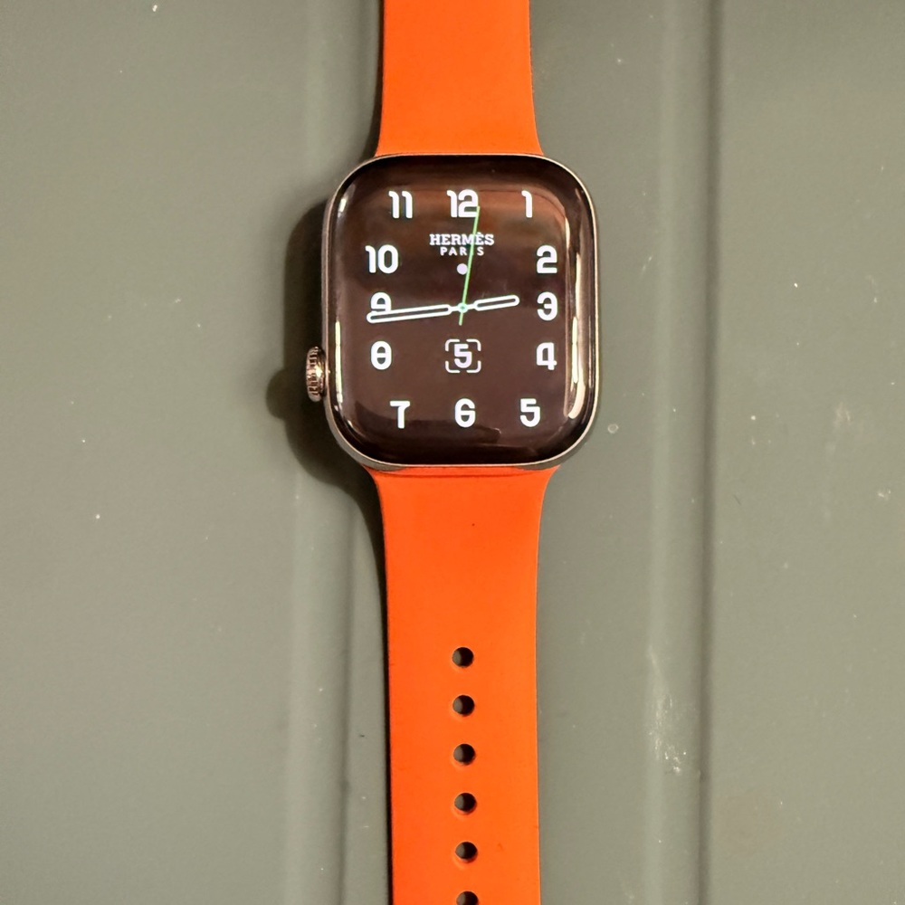 Preloved Apple Hermes Watch Series 10 with Hermes Silicone Orange Band.